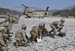 US soldiers during a field artillery battalion gun raid drill at a military training field in Pocheon on March 19.