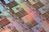A silicon wafer made by Taiwan Semiconductor Manufacturing Co. ( TSMC) is arranged for a photograph at the company's headquarters in Hsinchu, Taiwan, on Wednesday, Jan. 16, 2013.