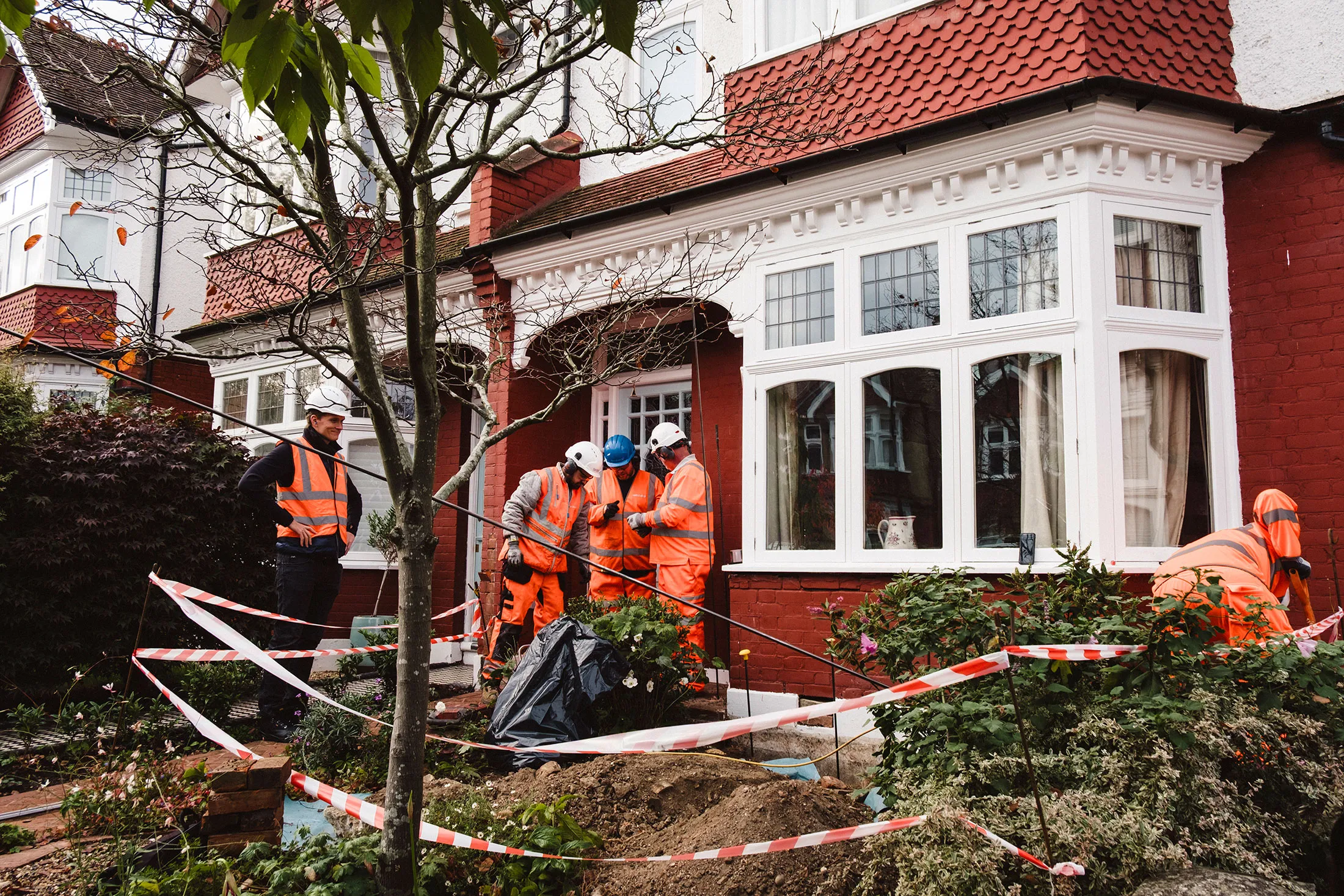 A Geobear team at work on an Edwardian-era home, with CEO Otso Lahtinen supervising on the far left.