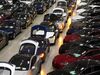 A line of new Tesla Model X sports utility vehicles (SUV), center, sit with Tesla Model S automobiles following assembly for the European market at the Tesla Motors Inc. factory in Tilburg, Netherlands.