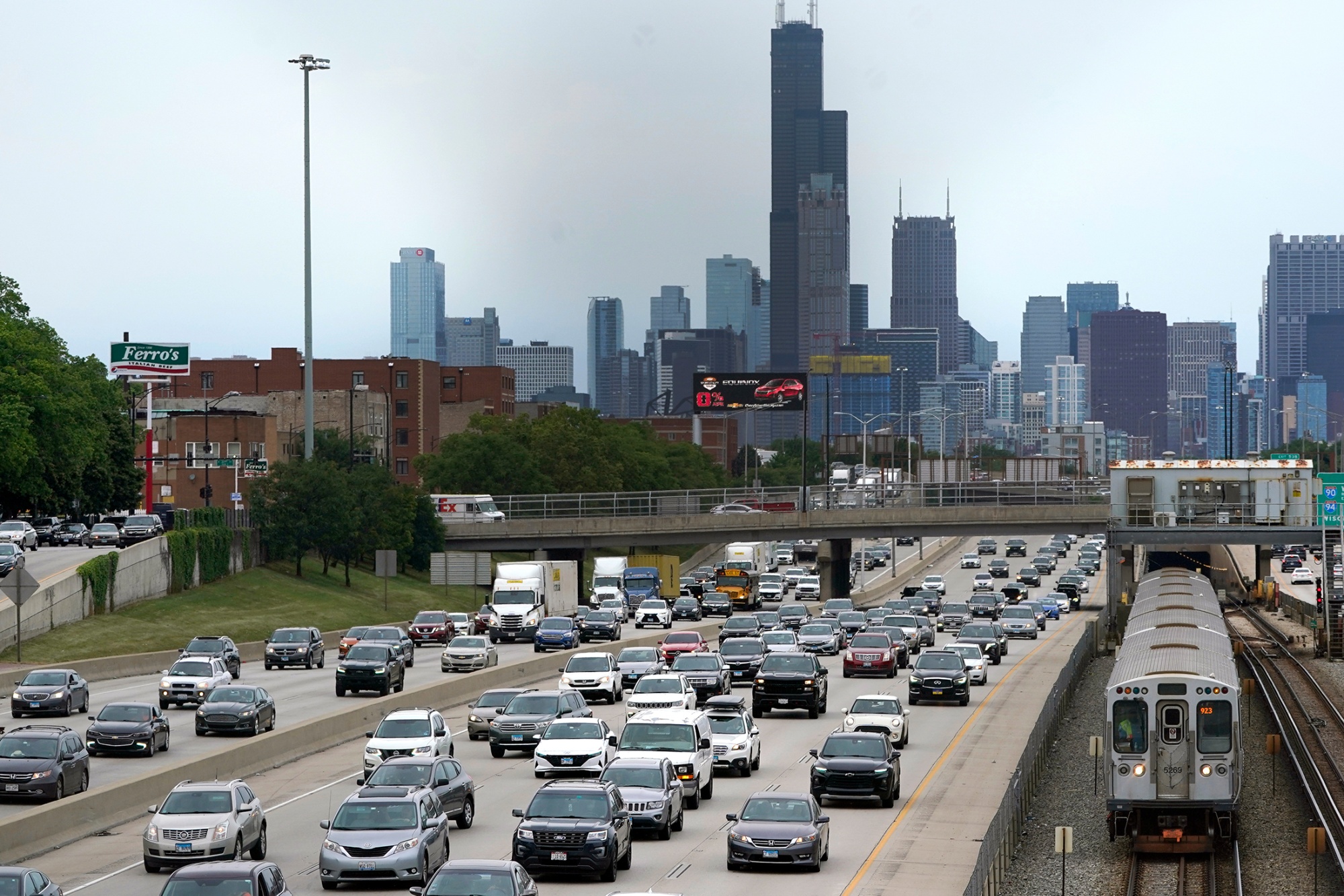 Southbound traffic is thick on Interstate 90-94&nbsp;as a CTA train enters a station, on the first day of the 2022 Fourth of July holiday weekend in Chicago.