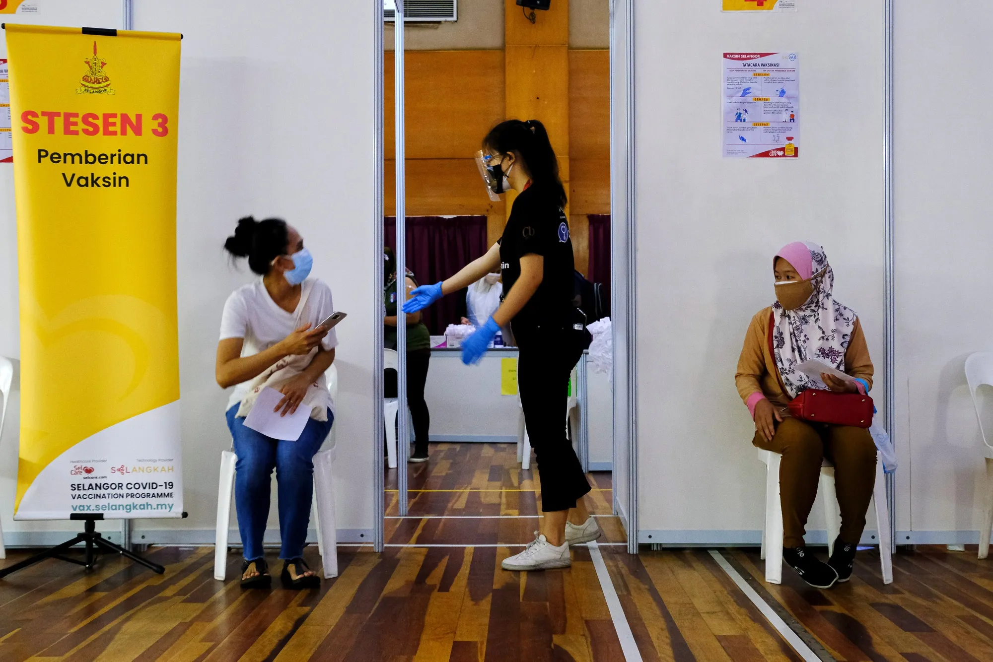 Visitors wait&nbsp;at a vaccination center&nbsp;in Kelana Jaya, Selangor, Malaysia.