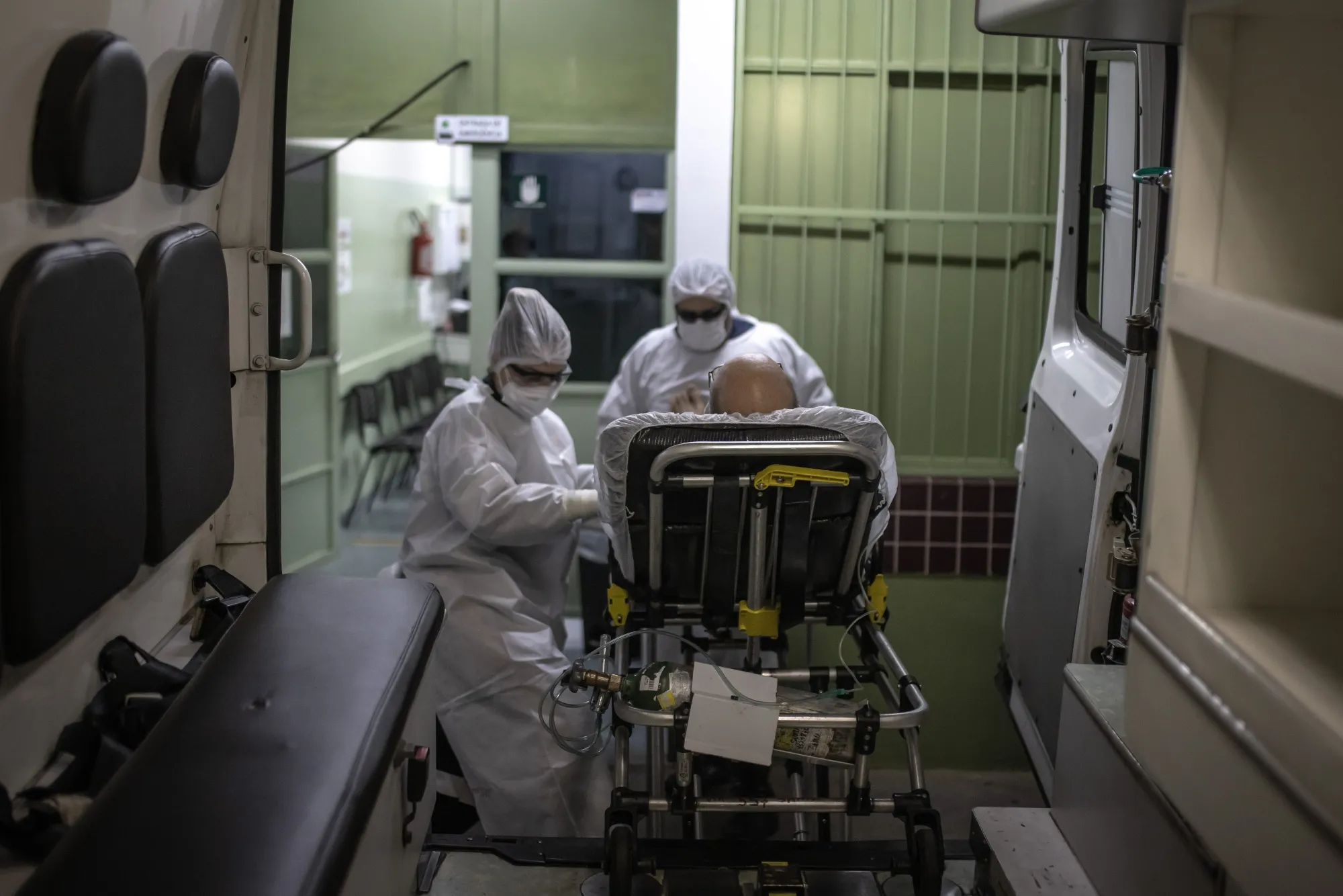 EMTs transfer a patient to a hospital in Bauru, Brazil, on&nbsp;Feb. 24.