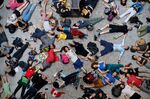 Extinction Rebellion climate change activists lie on the floor as they perform a mass &quot;die in&quot; in the main hall of the Natural History Museum in London on April 22, 2019.