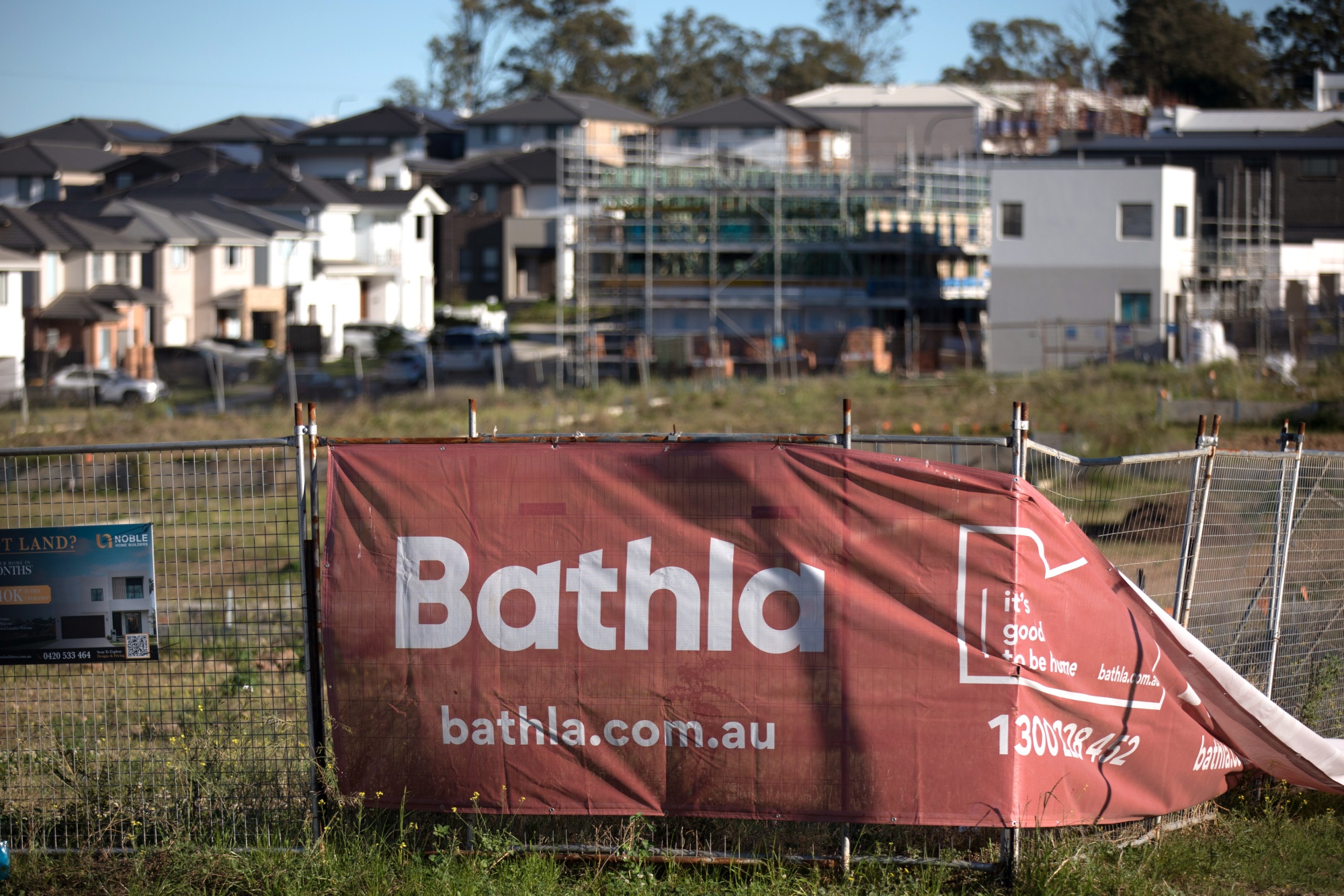 Bathla Group's signage at an unfinished residential development in the Rouse Hill suburb in Sydney. Photographer: Brent Lewin/Bloomberg