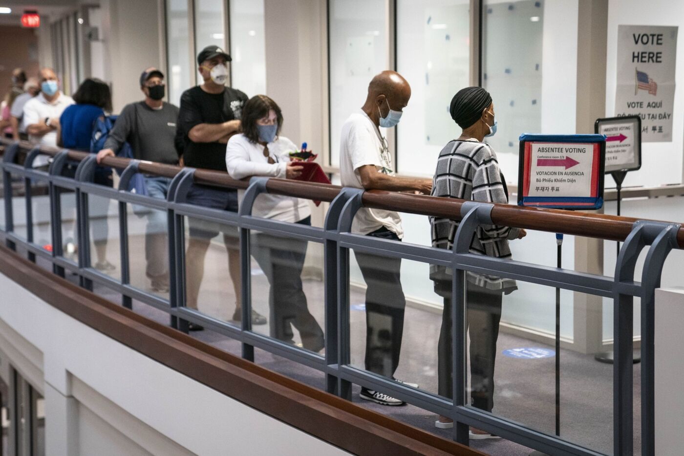 Voters stand in line to cast ballots at an early voting polling location for the 2020 presidential election in Fairfax, Virginia, on Sept. 18, 2020. Virginia became the first state to pass its own version of the federal Voting Rights Act this year.