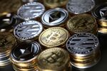 A collection of bitcoin, litecoin and ethereum tokens.
