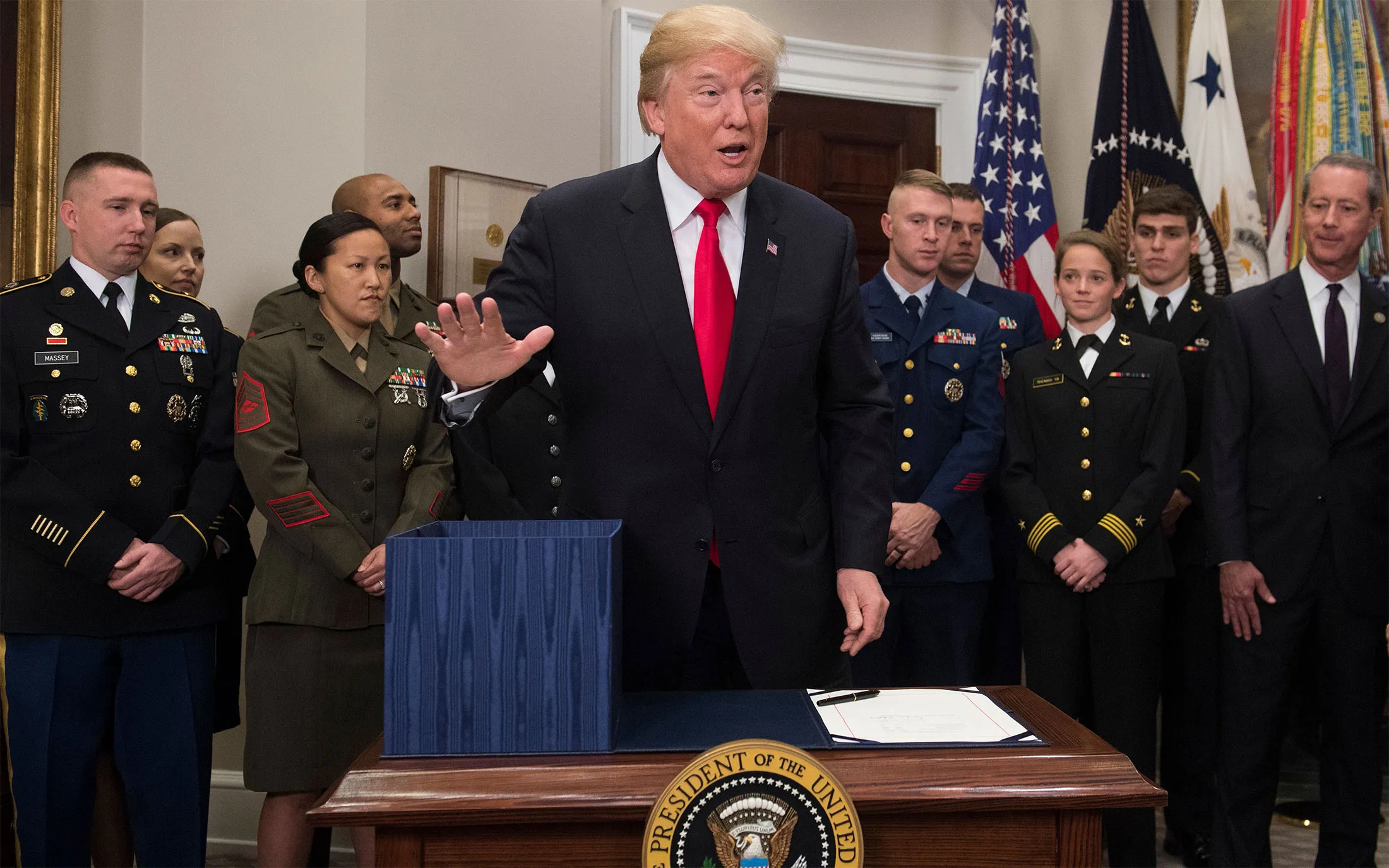 U.S. President Donald Trump prepares to sign H.R. 2810, National Defense Authorization Act for Fiscal Year 2018, during a signing ceremony in the Roosevelt Room at the White House on Dec. 12.