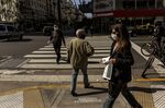 Pedestrians wearing protective masks walk in the Barrio Norte neighborhood of Buenos Aires, Argentina, on&nbsp;May 14.&nbsp;