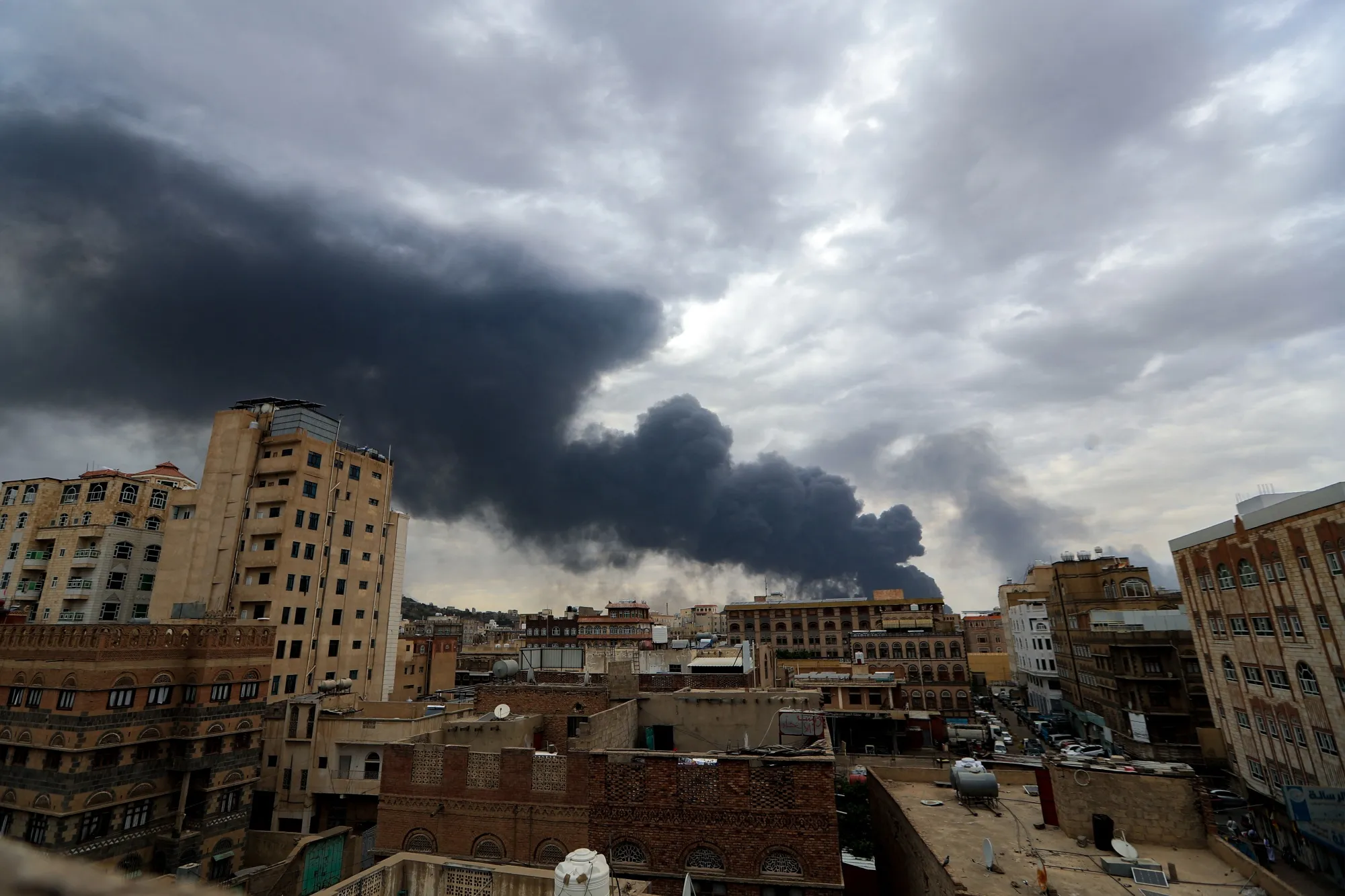Smoke billows on the horizon following an Israeli air strike on Sanaa, Yemen, on May 6.