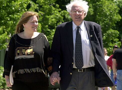 Bernie Sanders walks and his wife, Jane, during his re-election kickoff in Burlington, Vermont, in this June 24, 2002, file photo.
