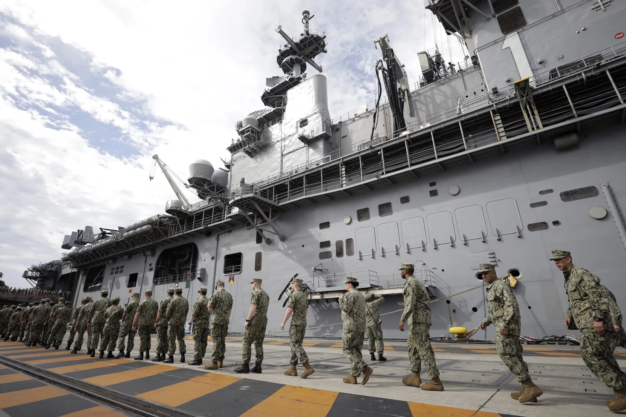 US&nbsp;military personnel gather to board the USS Wasp aircraft carrier at the US&nbsp;naval base in Yokosuka, Kanagawa Prefecture, Japan.