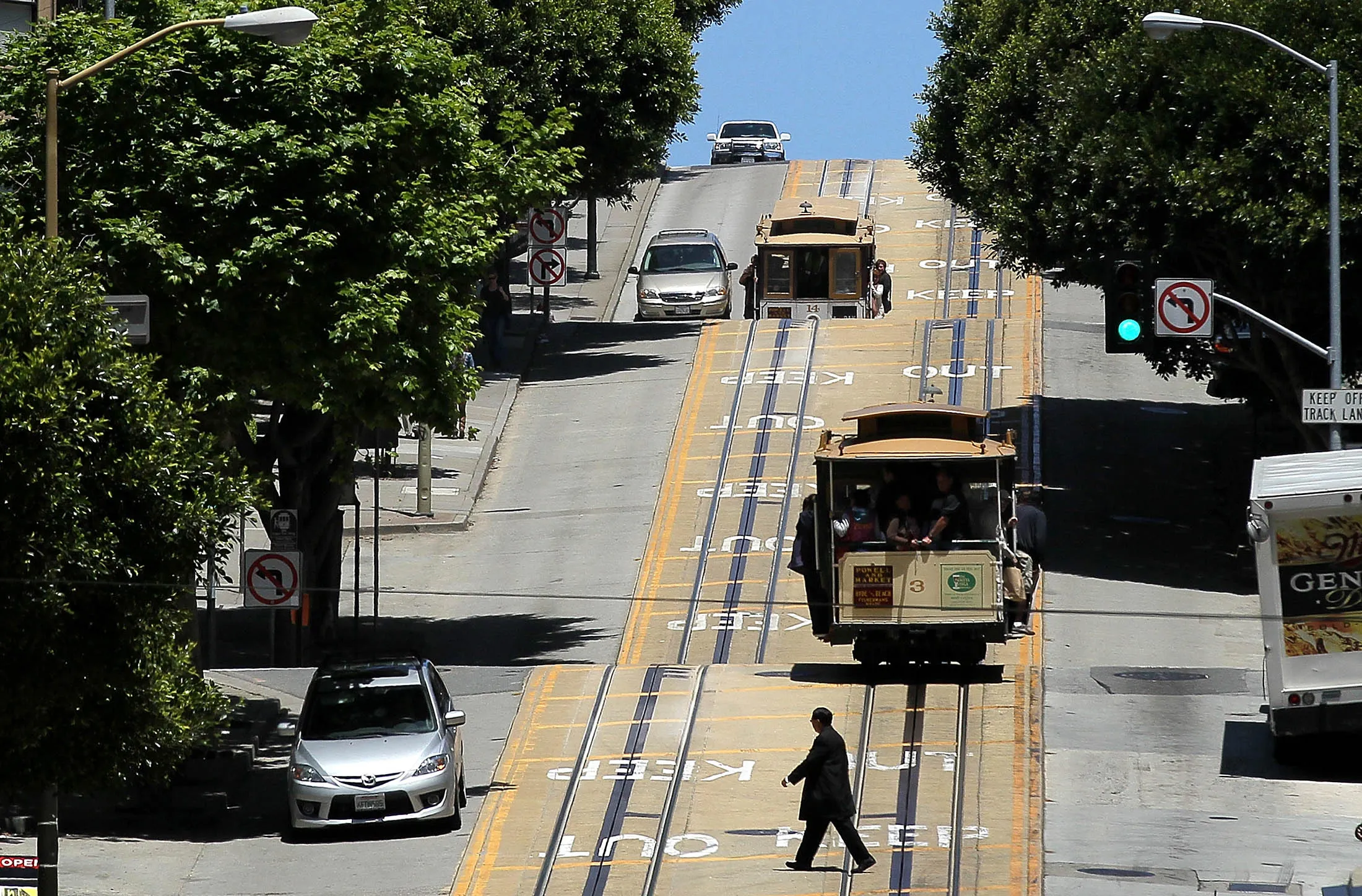 SAN FRANCISCO, CA - JUNE 09: Cable cars travel along Powell Street on June 9, 2011 in San Francisco, California. Beginning on July 1, the price for a ride on San Francisco's famed cable cars will increase one dollar to $6.00. An estimated 8 million people ride the cable cars each year.
