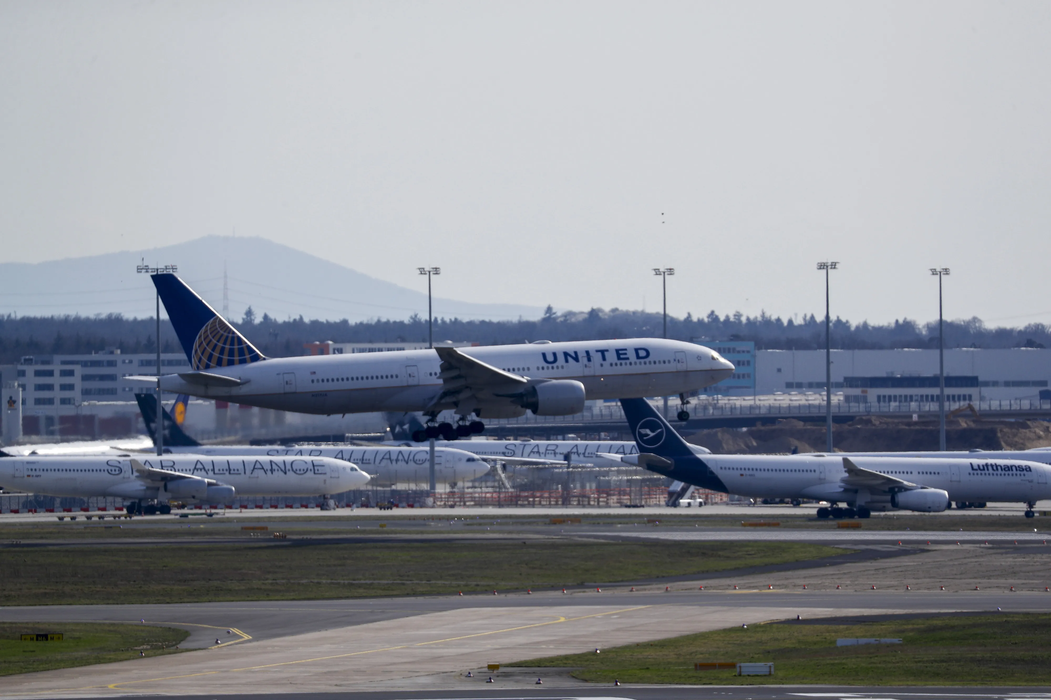 A passenger aircraft operated by United Airlines Holdings Inc. takes off from Frankfurt Airport.