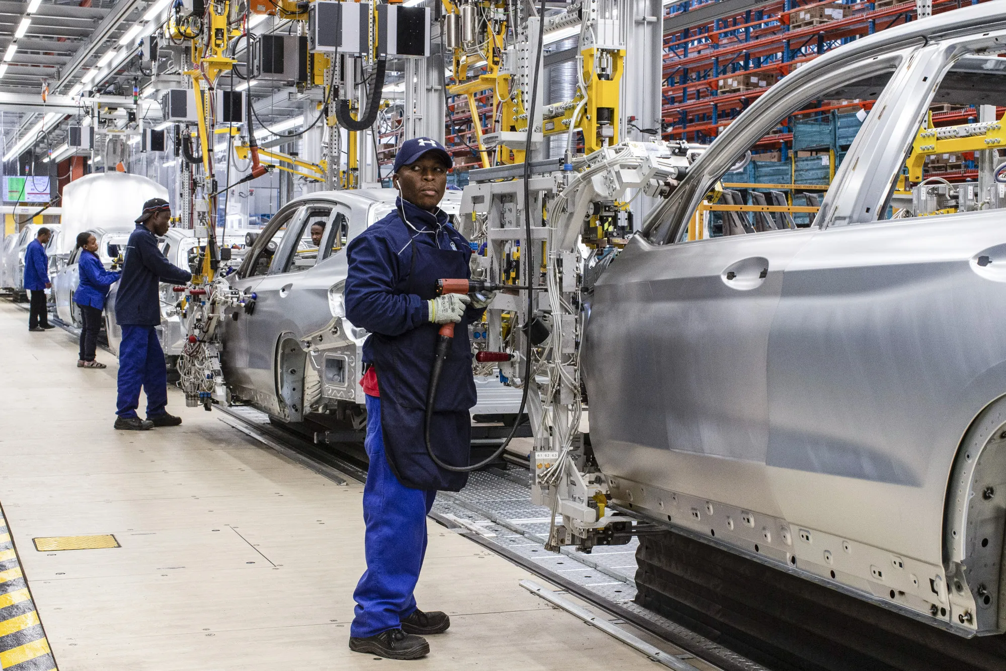 Workers assemble vehicles at the BMW South Africa Pty Ltd. Rosslyn plant in Midrand, South Africa.
