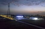 The Tesla Inc. Gigafactory stands illuminated at night in Shanghai, China, on Friday, Nov. 1, 2019.