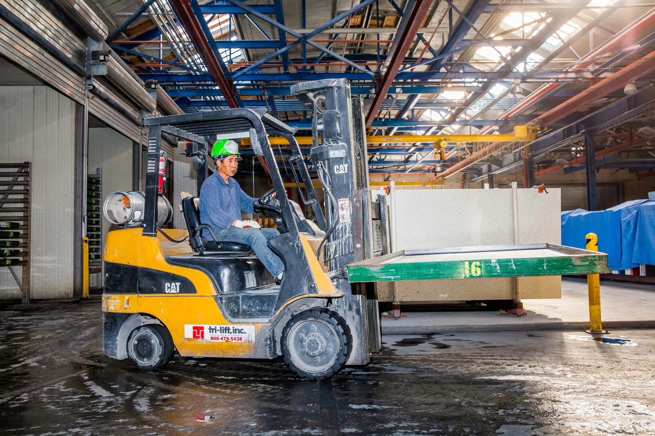A forklift driver at the IceStone manufacturing facility in Brooklyn, N.Y.
