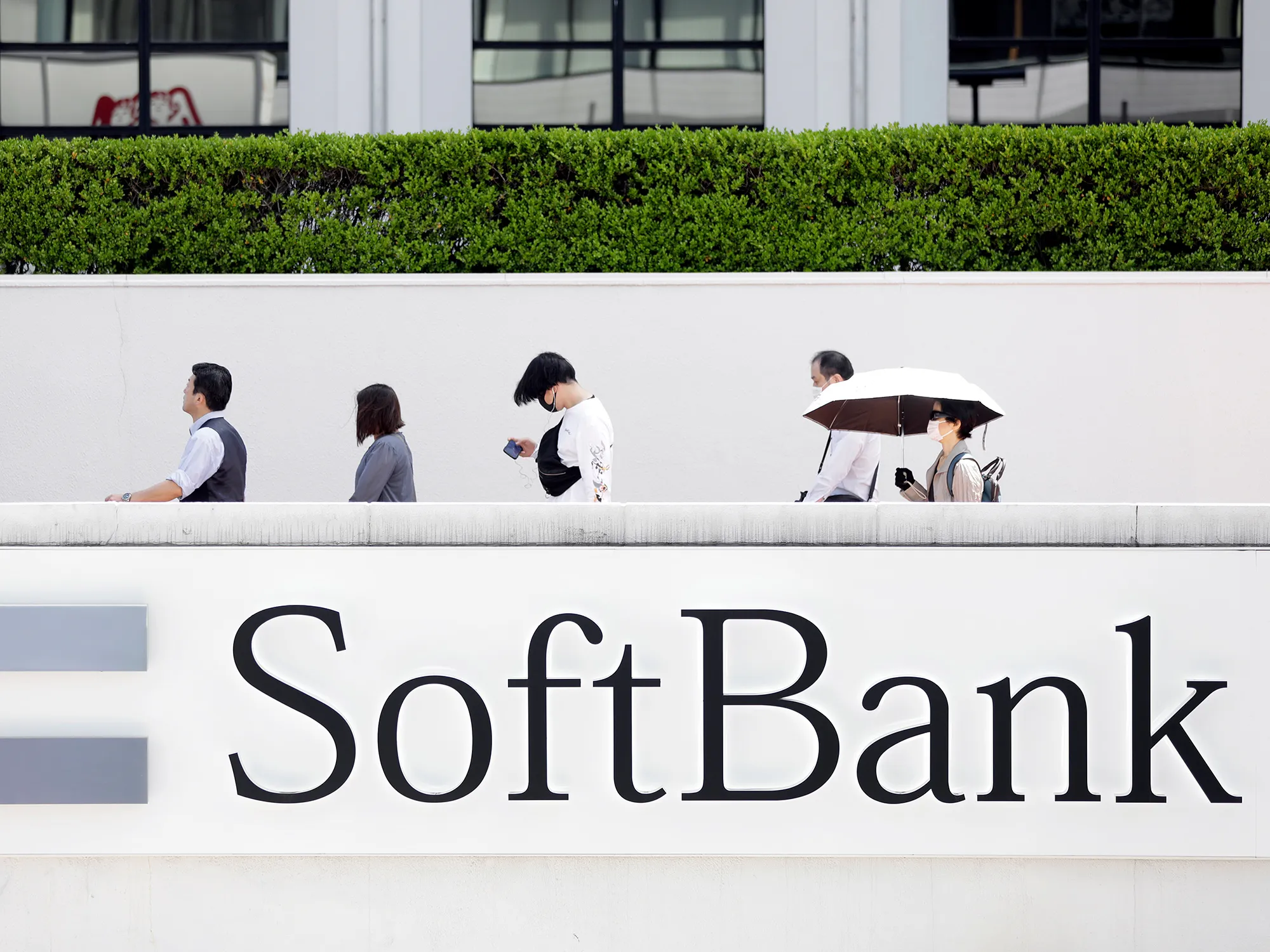 Signage for SoftBank Corp. near a store in Tokyo.