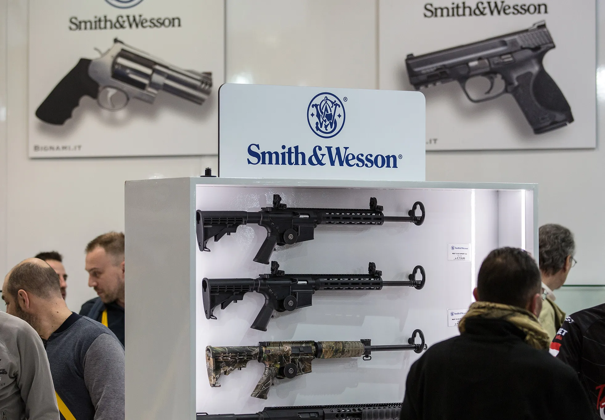 Fairgoers are pictured in front of the Smith &amp; Wesson display stand during the HIT SHOW exhibition on February 12, 2018 in Vicenza.