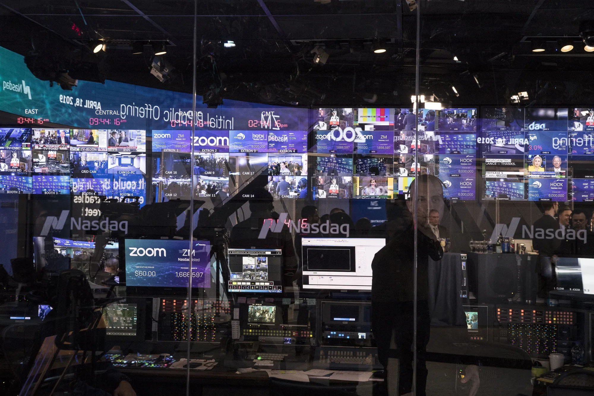 Zoom Video Communications Inc. signage is reflected in the window of the television production studio during the company's initial public offering at the Nasdaq MarketSite in New York on April 18, 2019.