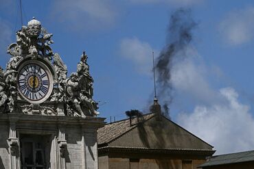 Black smoke rises from the Sistine Chapel on May 8.