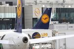 The Deutsche Lufthansa AG logo sits on the tail fins of passenger jets on the tarmac at Frankfurt Airport, operated by Fraport AG, in Frankfurt, Germany, on Monday, Sept. 26, 2016. Lufthansa is nearing an agreement to operate airplanes now flying under the Air Berlin Plc banner, according to two people with knowledge of the matter, letting Lufthansa bolster its discount flights as Air Berlin cuts back its routes.
