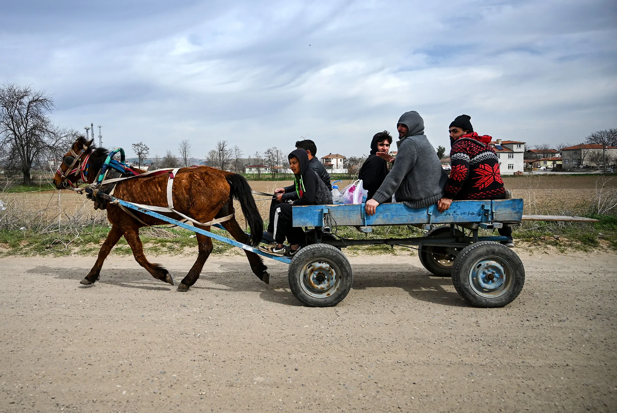Migrants travel&nbsp;on the Turkish side of the Turkey-Greece border near the Pazarkule crossing gate in Edirne province on March 9.&nbsp;
