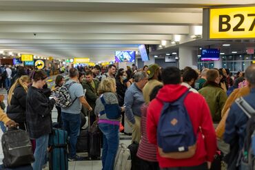 Travelers At JFK Airport Ahead Of Christmas Holiday