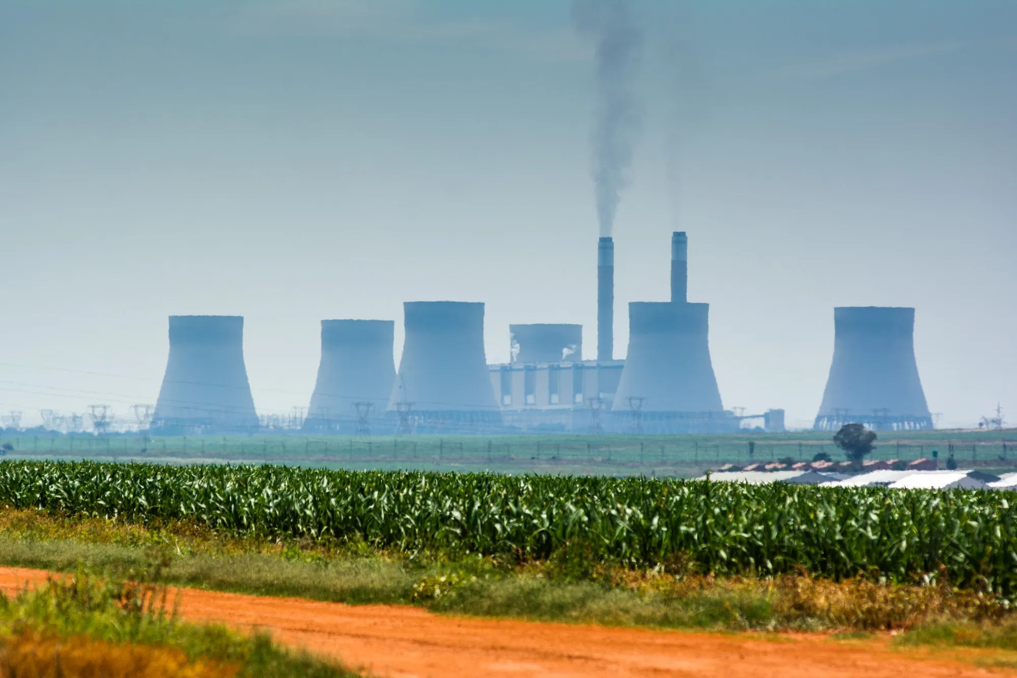 Emissions rise from an Eskom Holdings&nbsp;coal-fired power station in South Africa.