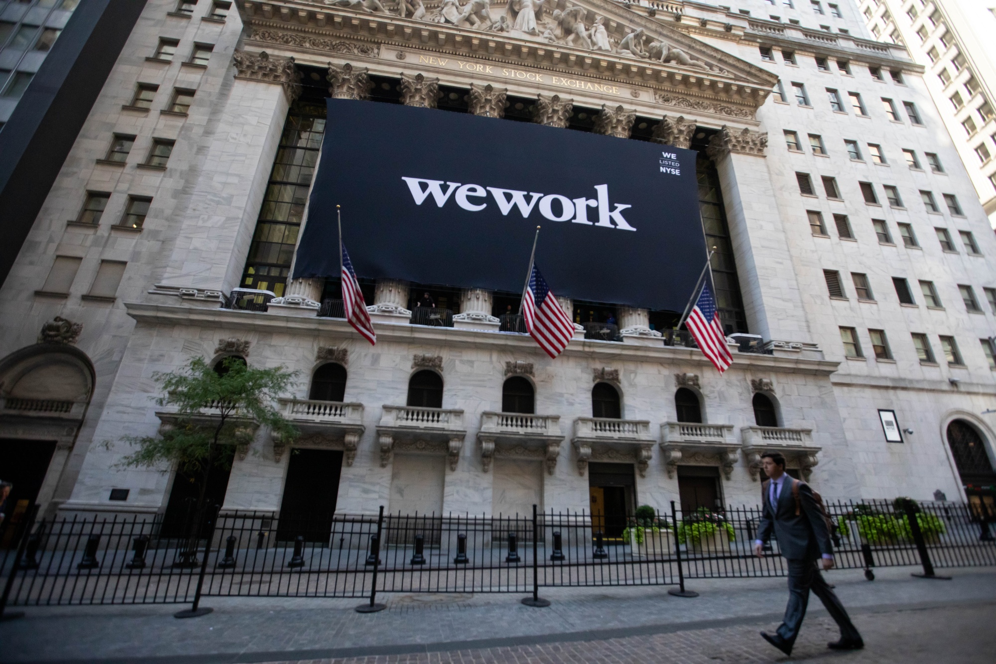 WeWork signage outside the New York Stock Exchange (NYSE) in New York, U.S., on Thursday, Oct. 21, 2021. 