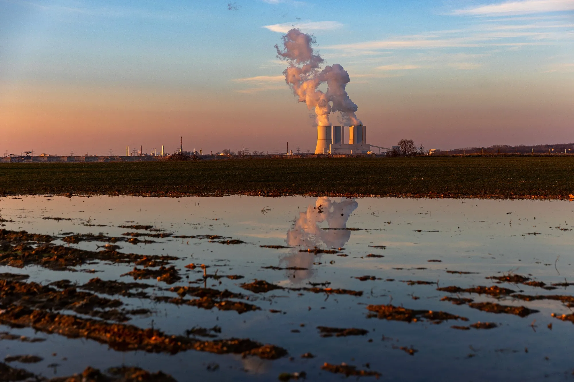 Cooling towers beyond wetlands at the Lippendorf lignite-fired power station in Germany.