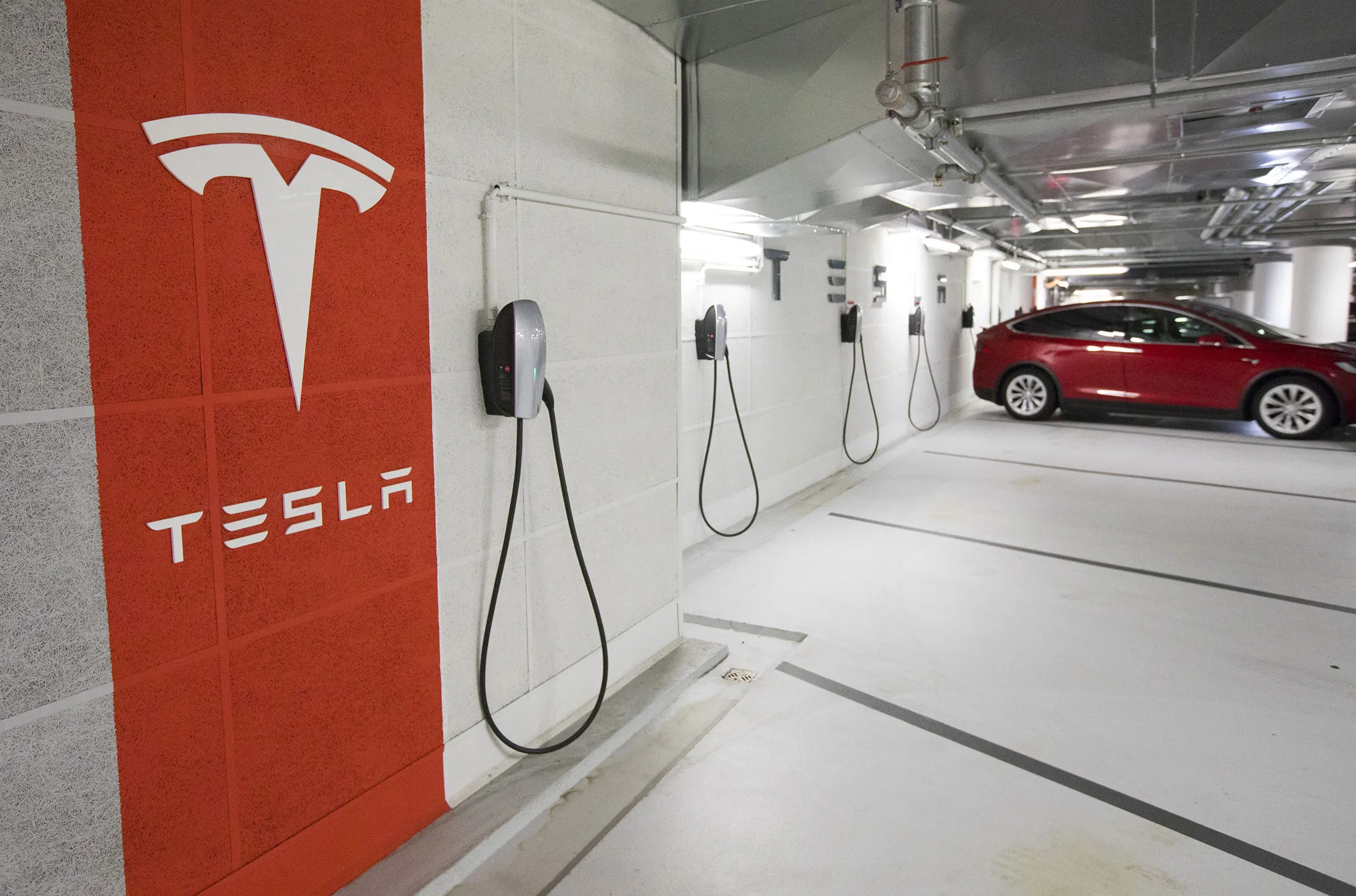 Tesla charging points in a parking lot.
