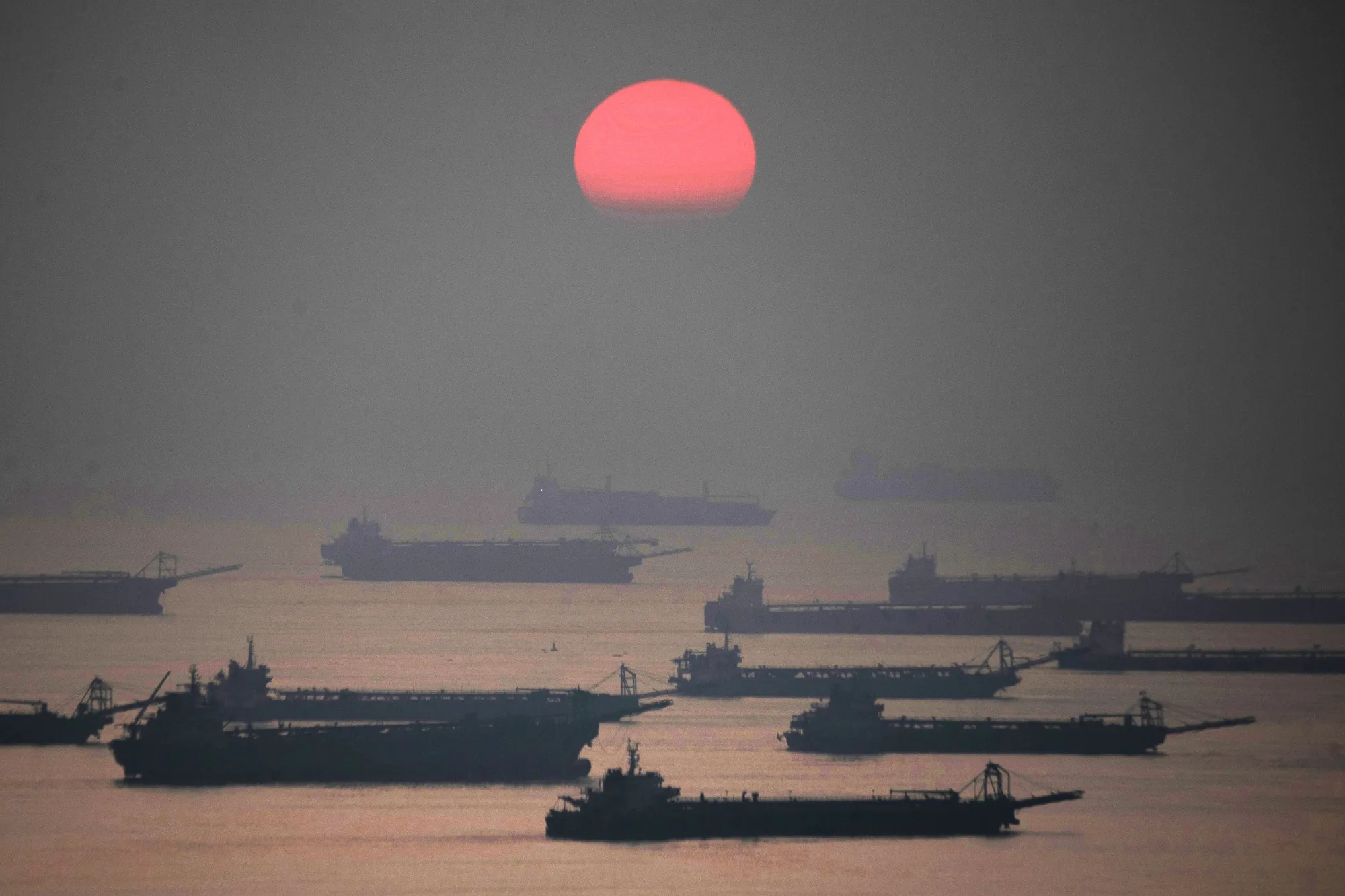 Anchored barges in Manila Bay.