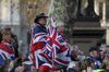 Pro-Brexit campaigners hold Union Flags, also known as Union Jacks, as they rally near the Houses of Parliament in London, U.K., on Friday, March 29, 2019. The British Parliament emphatically rejected Theresa May's Brexit deal for a third time, throwing the U.K. deeper into a political crisis that shows no sign of ending.