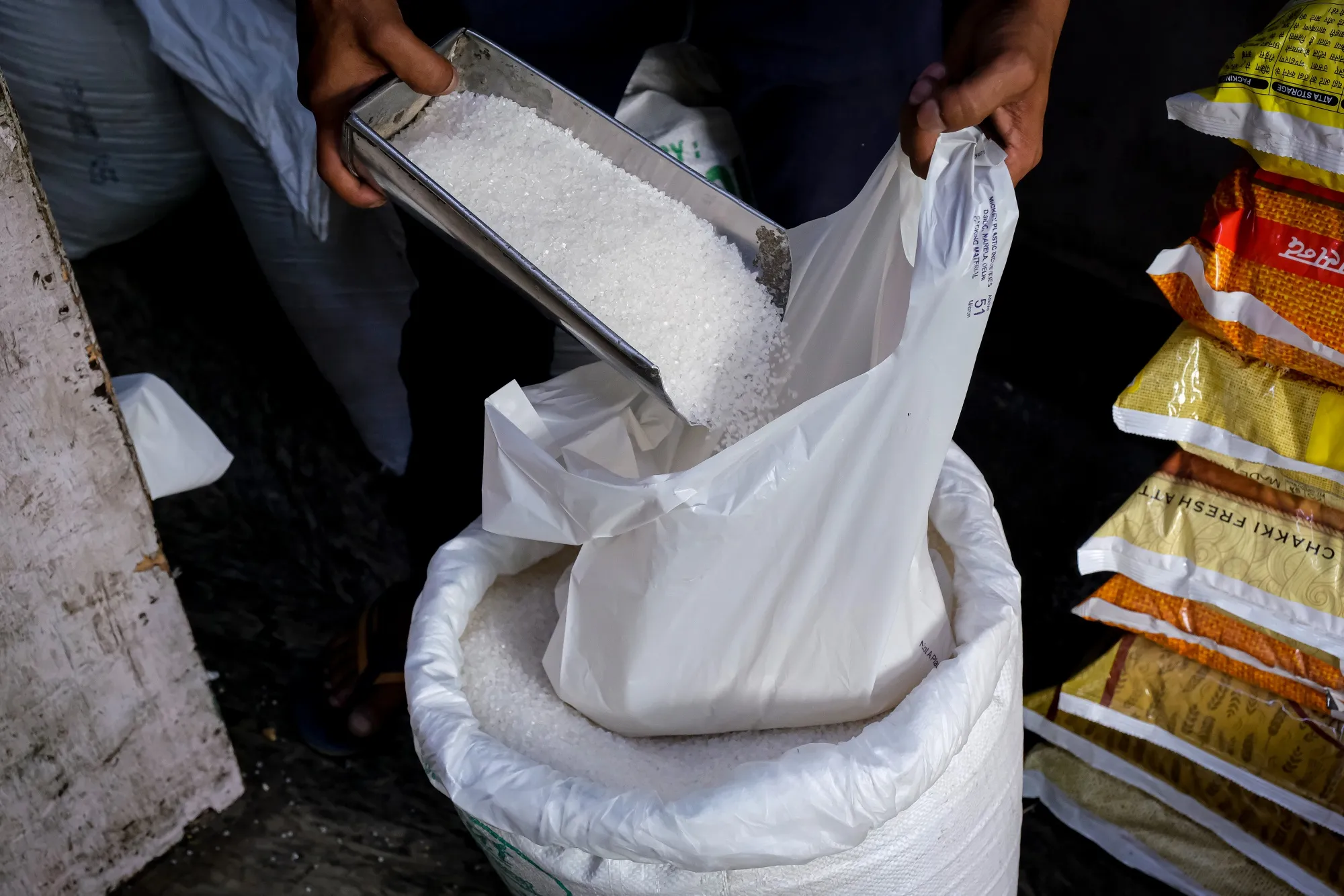 Sacks of refined sugar at a store in New Delhi, India.