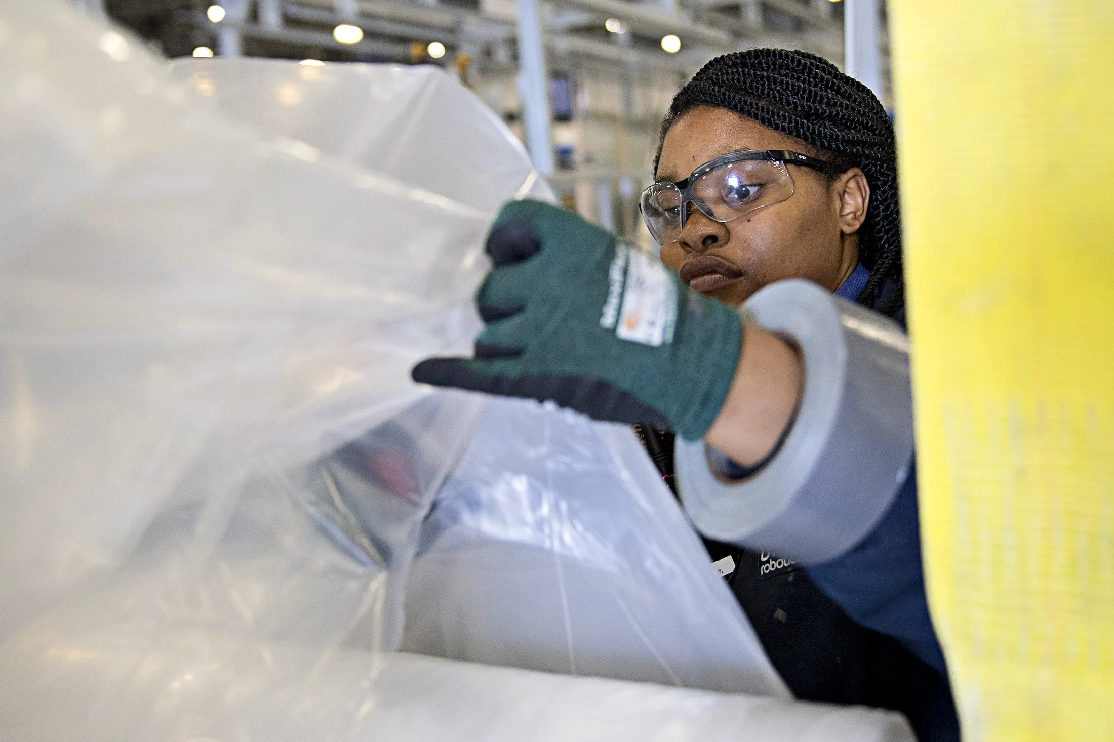 Employee Cyndicy Yarborough works at the Blueprint Robotics facility in Baltimore, Maryland, on Tuesday, April 10, 2017. The Blueprint factory is one of the first in the U.S. to use robots to help manufacture modular homes, and these robots are creating opportunities for people who wouldn't otherwise be a part of the homebuilding industry.
