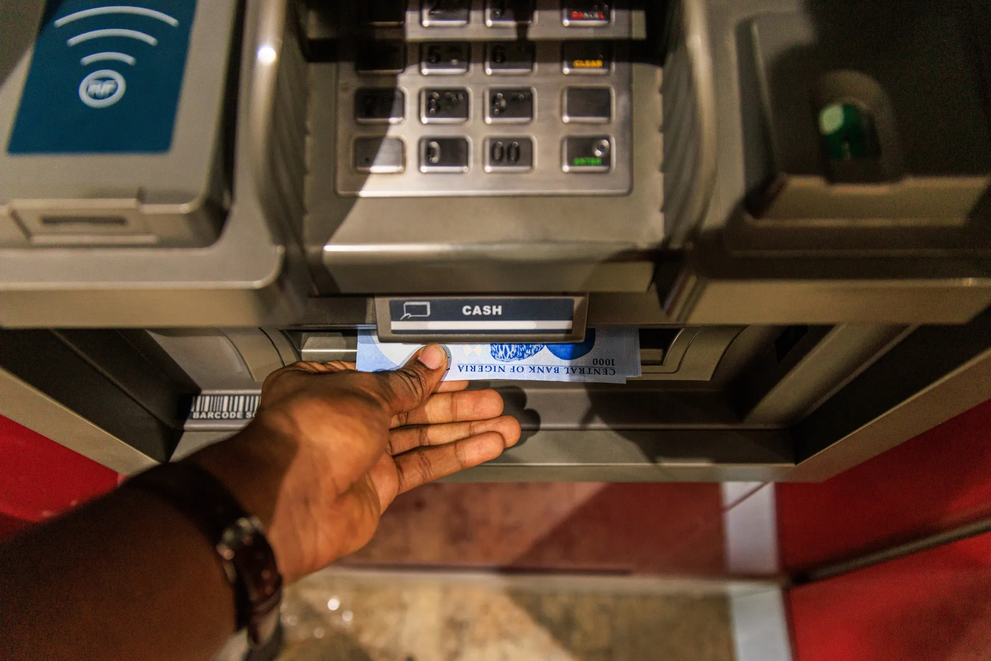 An ATM dispenses Nigerian 1000 naira banknotes in Lagos, Nigeria.