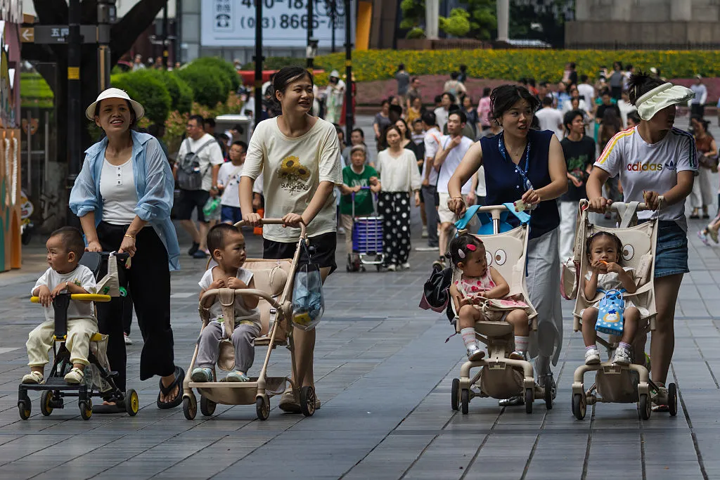 Women push baby strollers&nbsp;in Chongqing, China.