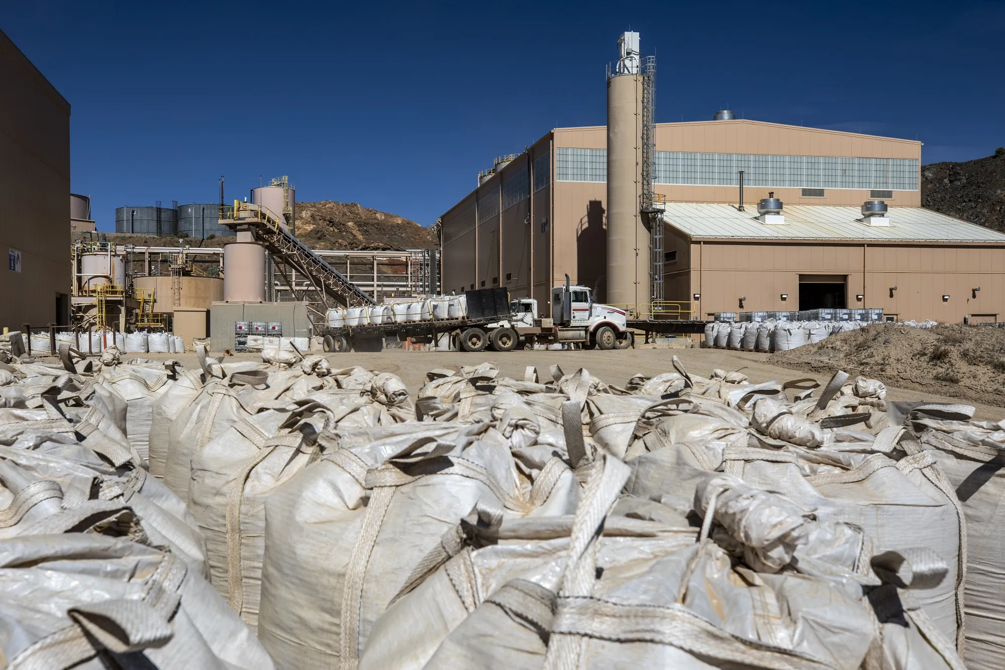 Bags of rare earth concentrates sit for transport at the Mountain Pass mine in Mountain Pass, California.