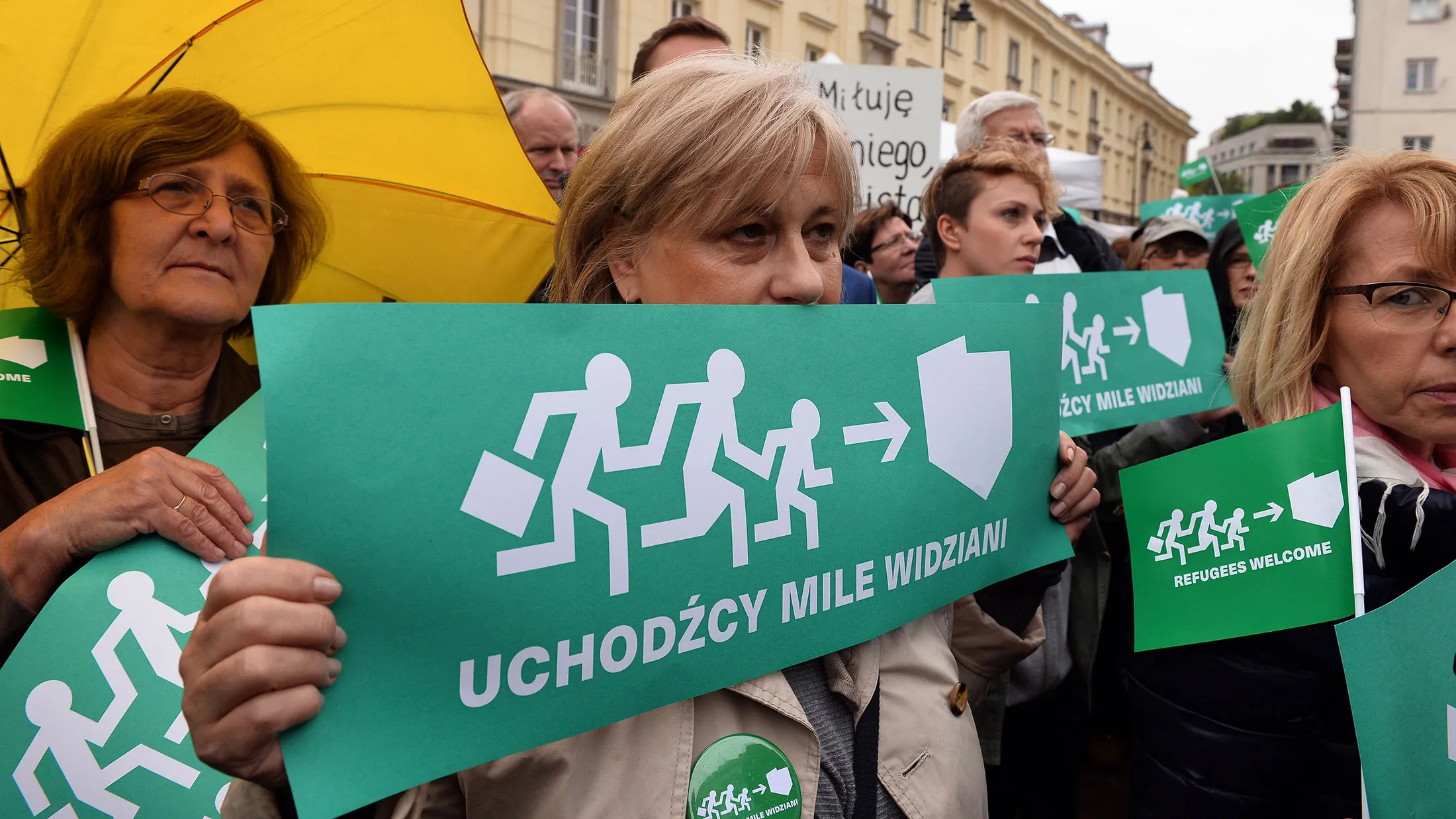 Participants of a pro-migrant demonstration hold placards in Warsaw on Sept. 12, 2015.
