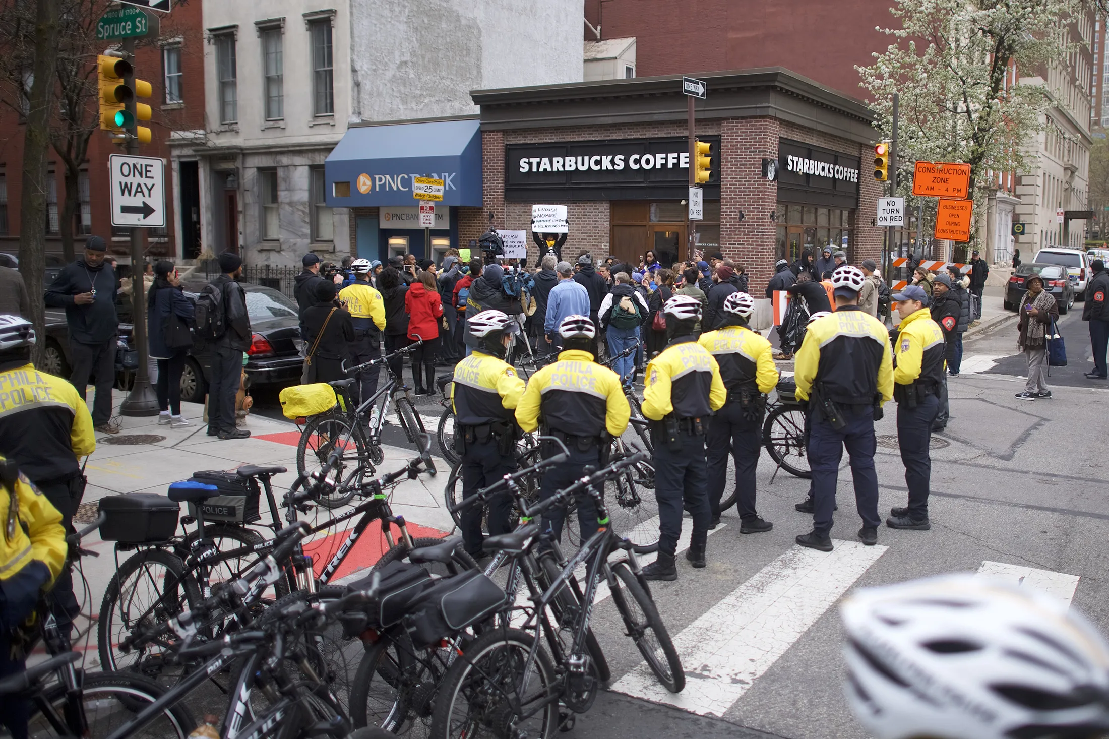 Police and protestors outside the&nbsp;Center City Starbucks on April 15.