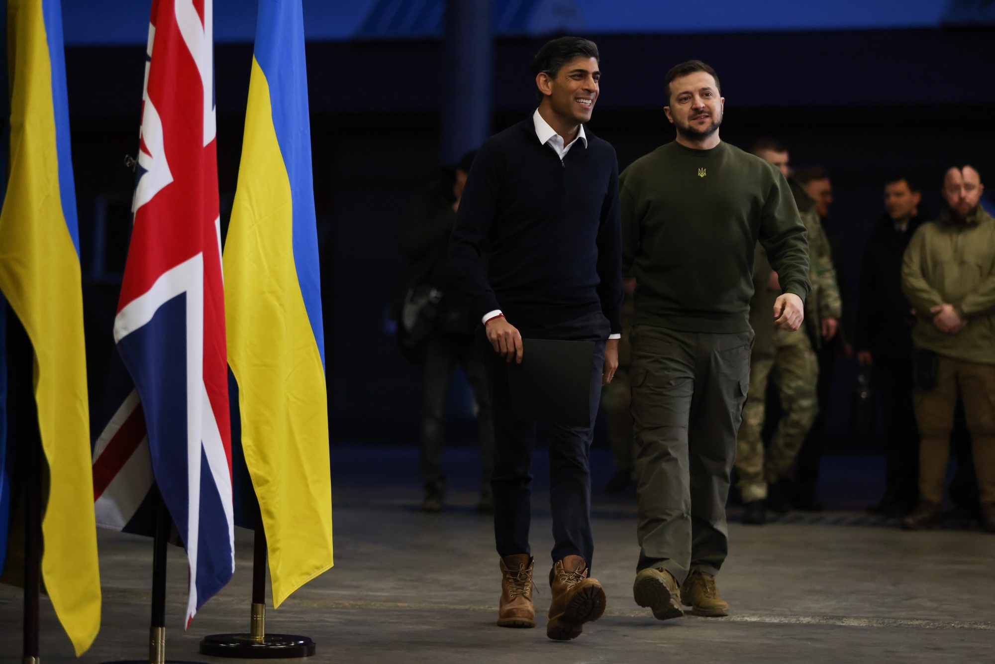 Volodymyr Zelenskiy, right, and Rishi Sunak arrive&nbsp;for a joint news conference&nbsp;in Lulworth Camp, UK, on&nbsp;Feb. 8.&nbsp;