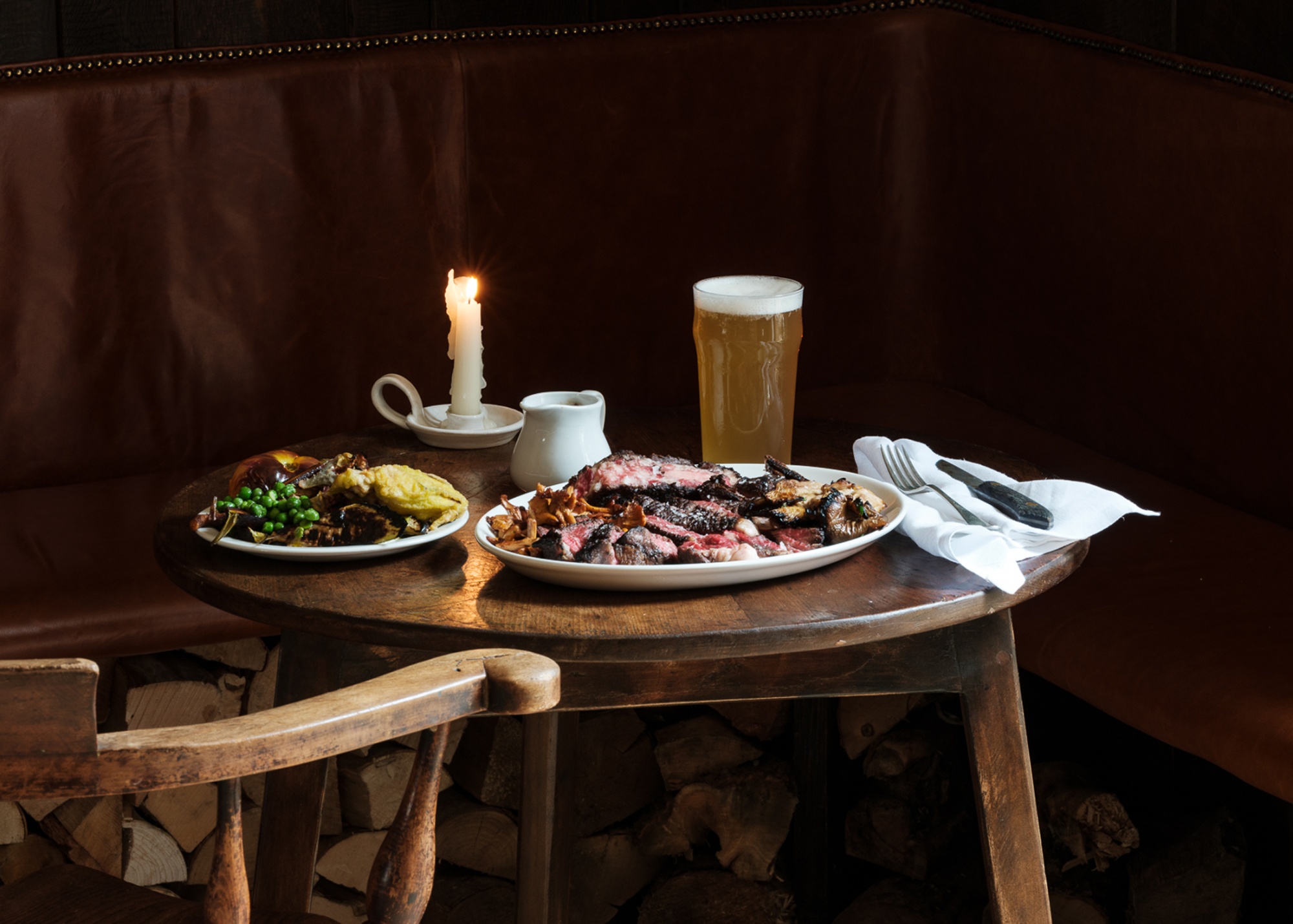 Roast meat dominates a cozy table at Cotswolds favorite the Bull in Charlbury.