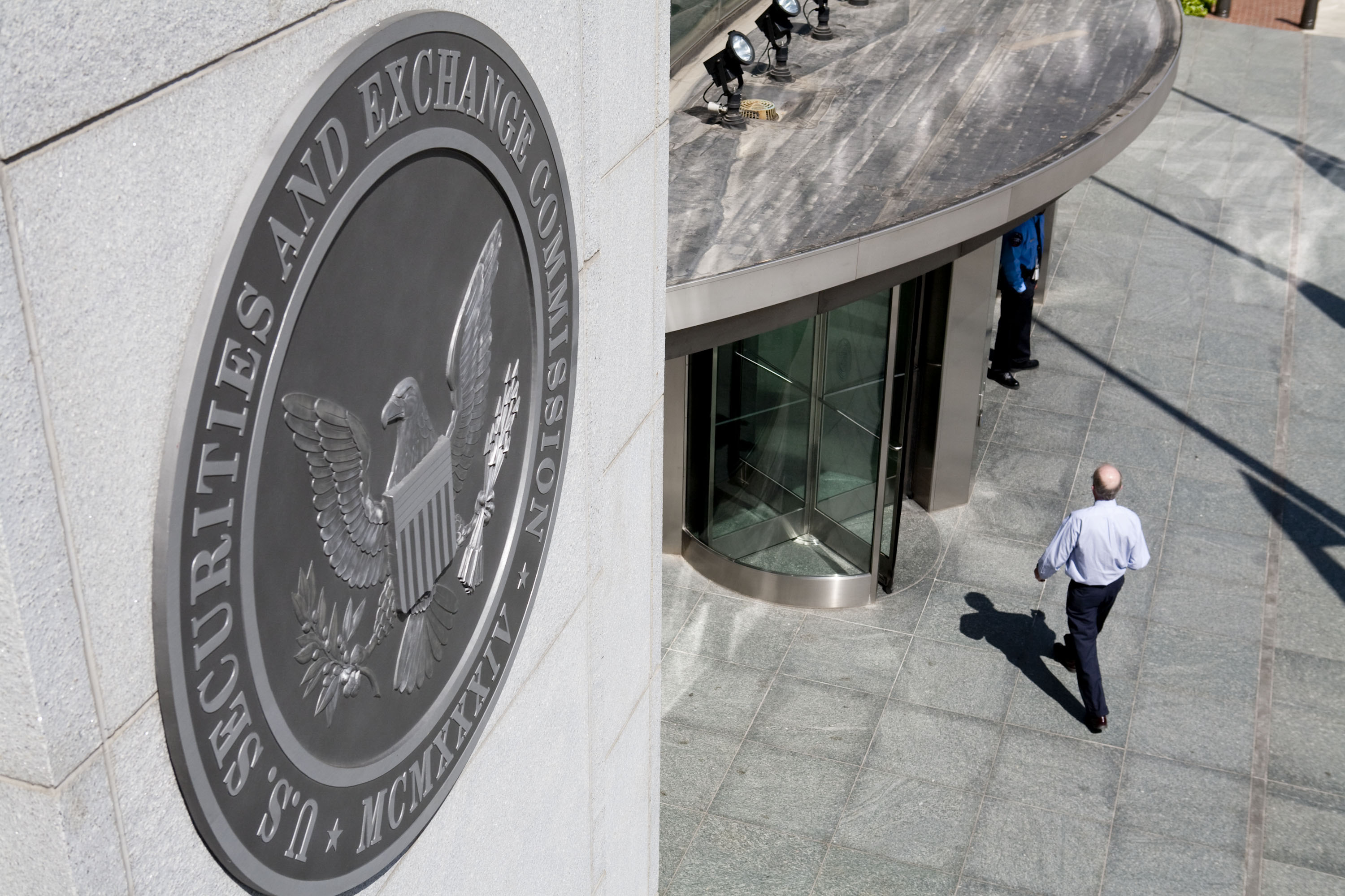 A person walks into&nbsp;the US Securities and Exchange Commission headquarters in Washington, DC.