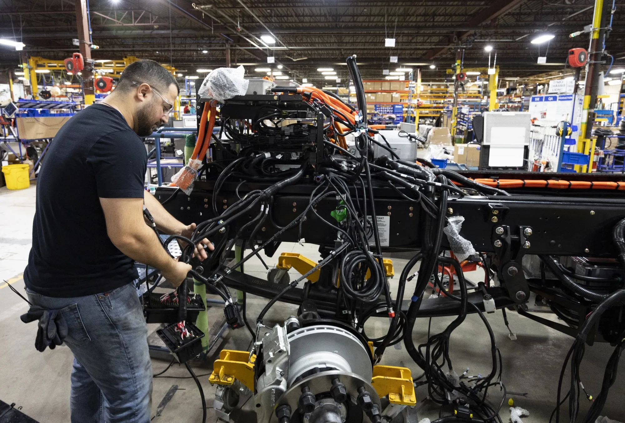 A worker assembles a Lion 6 electric truck&nbsp;in Saint-Jerome, Quebec, Canada, in 2022.