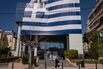 A large Greek flag outside a building in Glyfada near Athens.