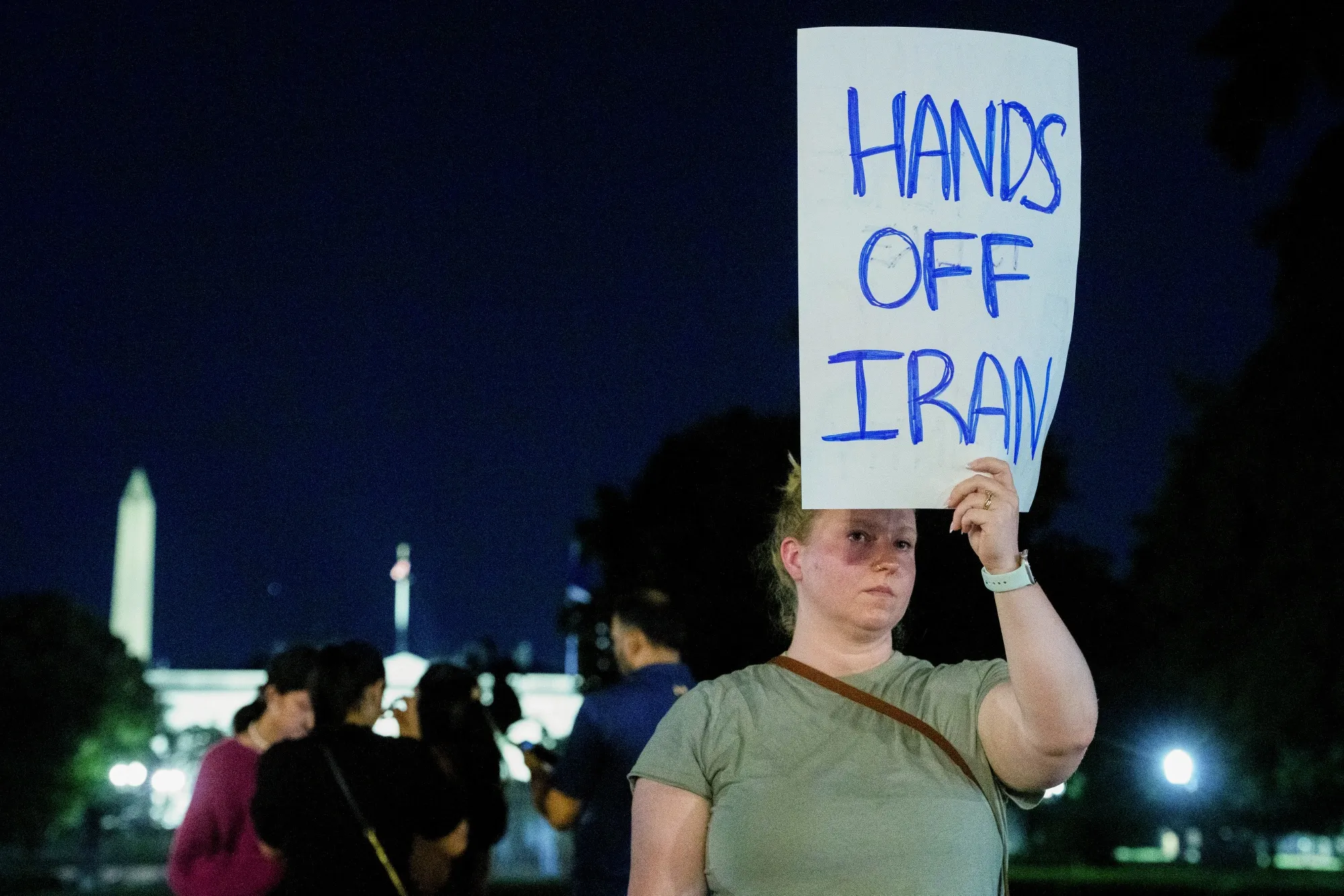 A demonstrator holds a sign outside the White House in Washington, on Saturday, June 21, 2025.&nbsp;