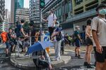 People take rest at the bollard during an anti-National Security Law protest in Hong Kong, China.