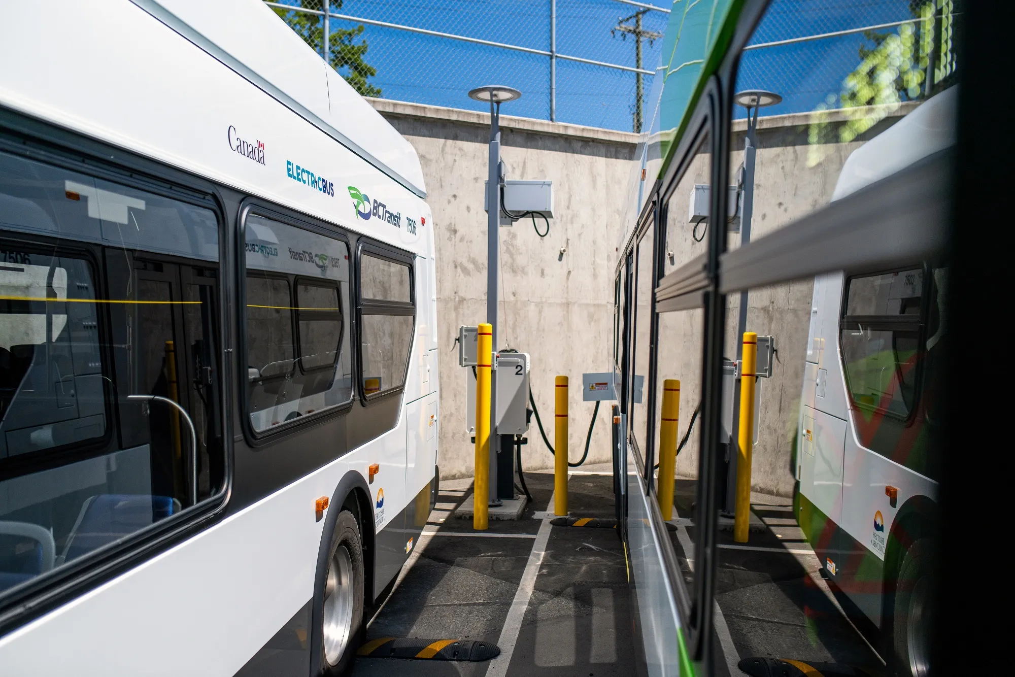A new electric bus is plugged into a charger at the BC Transit Victoria Transit Depot in Victoria, British Columbia, Canada, on Thursday, July 3, 2025.&nbsp;