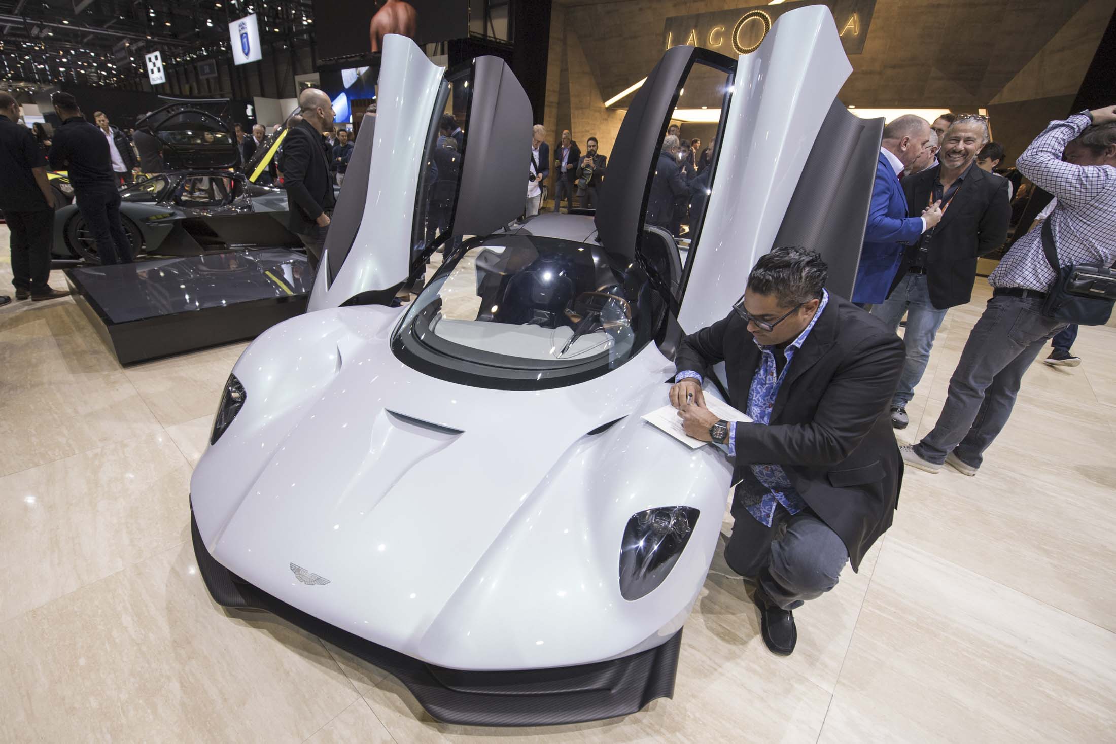 Singh&nbsp;signing a ­contract for the ­Aston Martin 003.